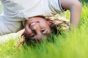 shutterstock_139166480 boy standing on head